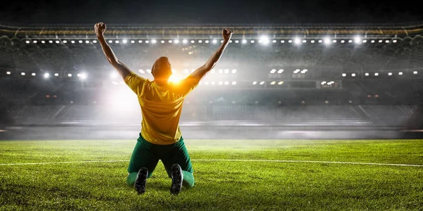 depositphotos 180494320 stock photo soccer player at stadium mixed